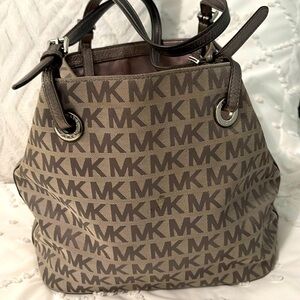 Michael Kors gray bag . Metallic gray leather straps